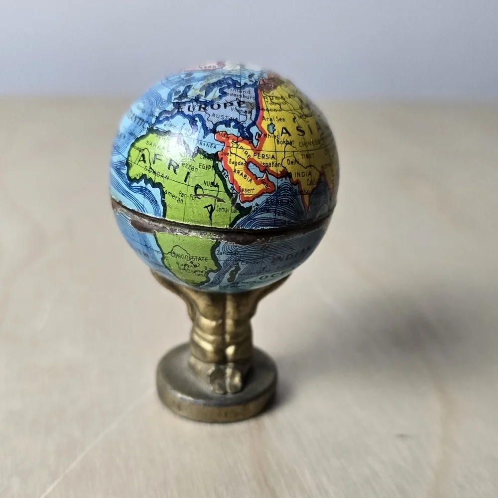 1920s Antique Atlas Holding Earth Pencil Sharpener Made In Germany Trade Routes